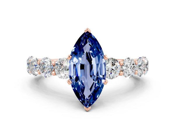 Rose gold Marquise Cut Blue Sapphire Prong Setting with Side Stones on a Pave Band