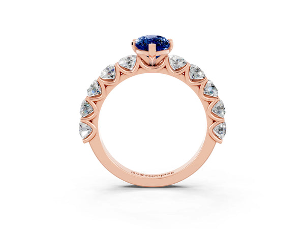Rose gold Marquise Cut Blue Sapphire Prong Setting with Side Stones on a Pave Band