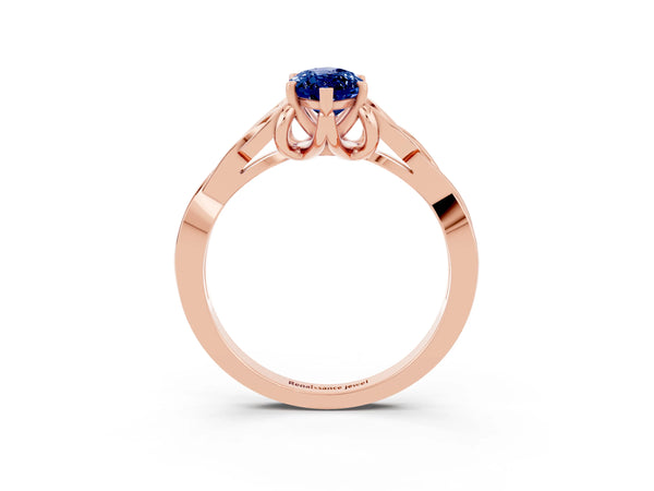 Rose gold Marquise Cut Blue Sapphire Solitaire Engagement Ring with Celtic Knot Band and Four-Prong Setting