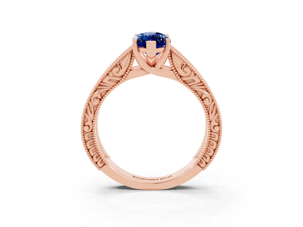 Rose gold Marquise Cut Blue Sapphire Solitaire Ring with Engraved Band and Four-Prong Setting