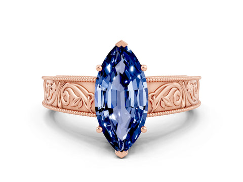 Rose gold Marquise Cut Blue Sapphire Solitaire Ring with Engraved Band and Four-Prong Setting