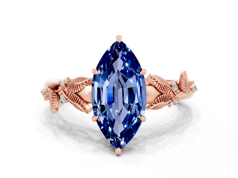 Rose gold Marquise Cut Blue Sapphire Solitaire Ring with Leaf Motif Band and Four-Prong Setting