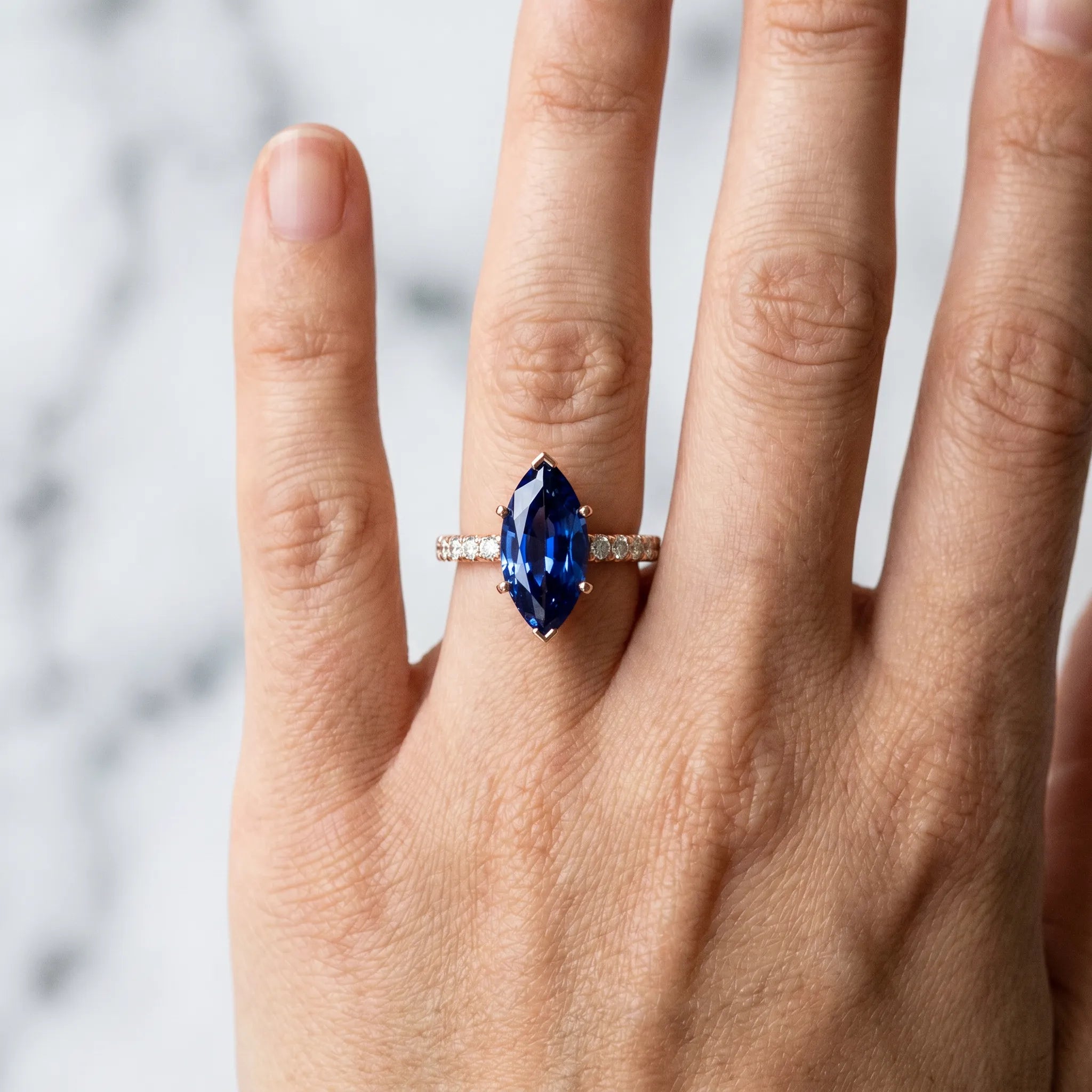 Rose gold Marquise Cut Blue Sapphire Solitaire Ring with Round  Pavé Band and Four-Prong Setting_42