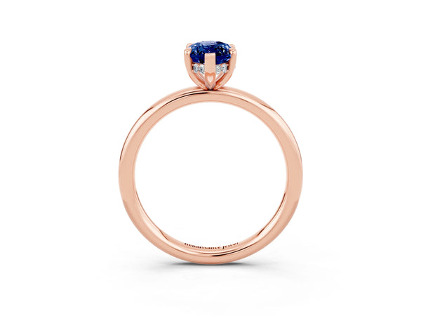 Rose gold Marquise Cut Blue Sapphire Solitaire Ring with Thin Band and Four-Prong Setting