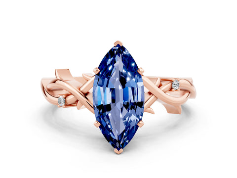 Rose gold Marquise Cut Blue Sapphire Solitaire Ring with Twisted Band and Prong Setting