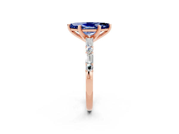 Rose gold Marquise Cut Blue Sapphire Solitaire with Side Baguettes and Channel Set Band