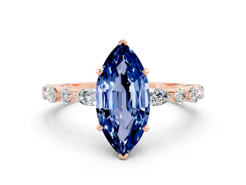 Rose gold Marquise Cut Blue Sapphire Solitaire with Side Stones on a Pavé Band and Four-Prong Setting