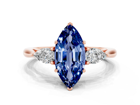 Rose gold Marquise Cut Blue Sapphire Three-Stone Ring with Pear Side Stones and Four-Prong Setting_12