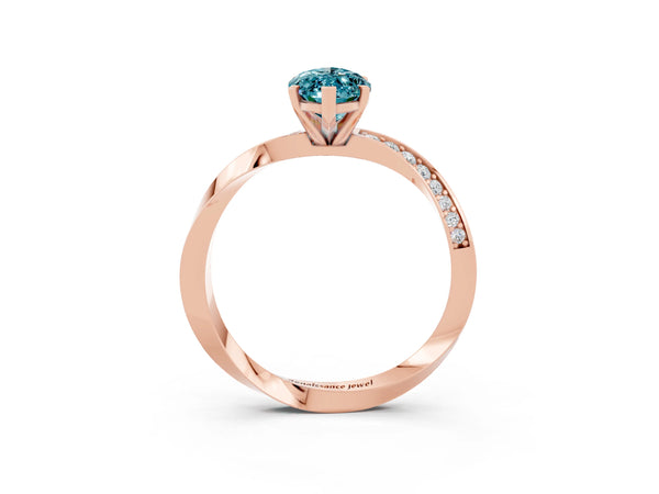 Rose gold Marquise Cut Blue Topaz Engagement Ring with Side Stone Accents and Four-Prong Setting