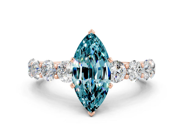 Rose gold Marquise Cut Blue Topaz Prong Setting with Side Stones on a Pave Band