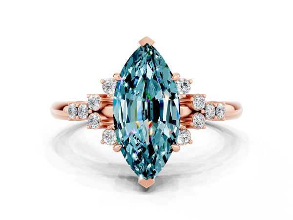 Rose gold Marquise Cut Blue Topaz Ring with Side Stones and Four-Prong Setting