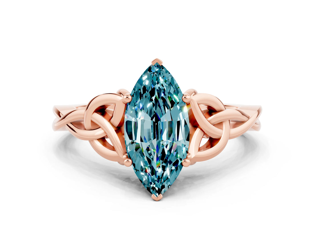 Rose gold Marquise Cut Blue Topaz Solitaire Engagement Ring with Celtic Knot Band and Four-Prong Setting