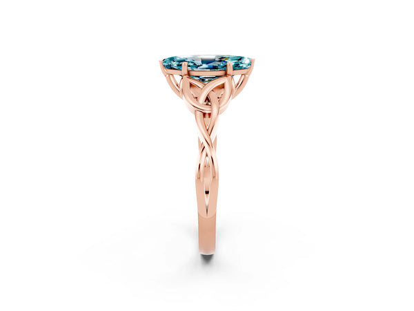 Rose gold Marquise Cut Blue Topaz Solitaire Engagement Ring with Celtic Knot Band and Four-Prong Setting