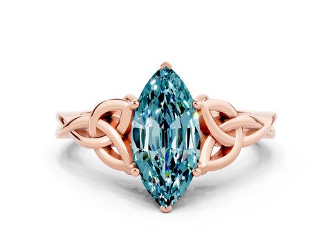Rose gold Marquise Cut Blue Topaz Solitaire Engagement Ring with Celtic Knot Band and Four-Prong Setting
