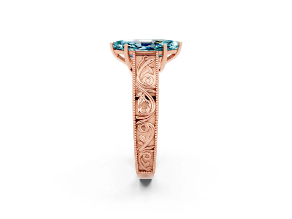 Rose gold Marquise Cut Blue Topaz Solitaire Ring with Engraved Band and Four-Prong Setting