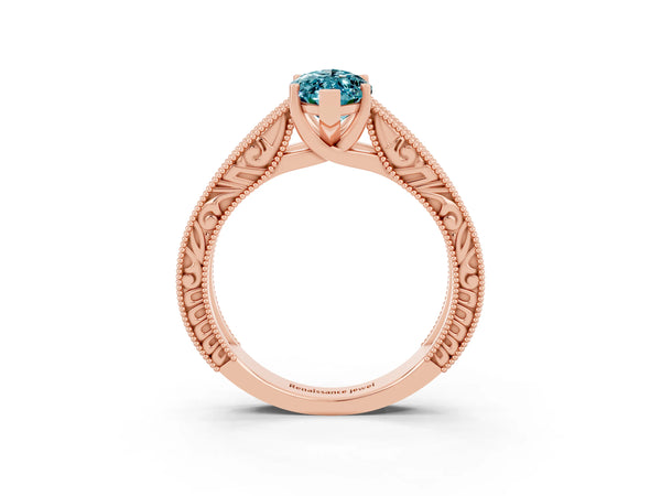 Rose gold Marquise Cut Blue Topaz Solitaire Ring with Engraved Band and Four-Prong Setting