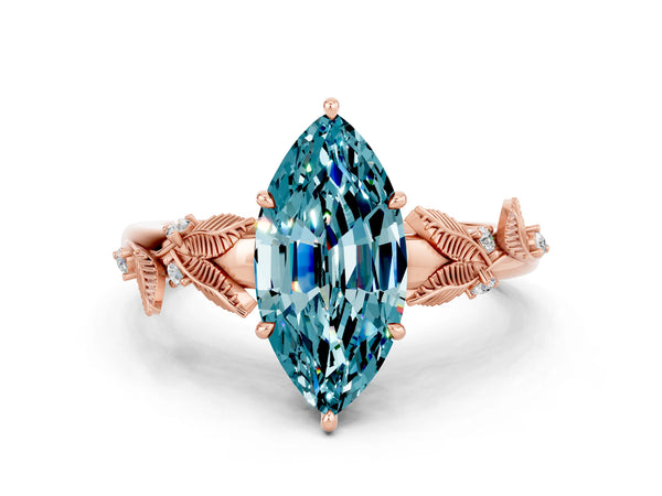 Rose gold Marquise Cut Blue Topaz Solitaire Ring with Leaf Motif Band and Four-Prong Setting