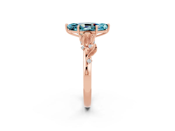 Rose gold Marquise Cut Blue Topaz Solitaire Ring with Leaf Motif Band and Four-Prong Setting