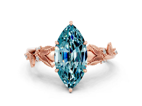 Rose gold Marquise Cut Blue Topaz Solitaire Ring with Leaf Motif Band and Four-Prong Setting