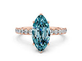 Rose gold Marquise Cut Blue Topaz Solitaire Ring with Pavé Accents and Four-Prong Setting