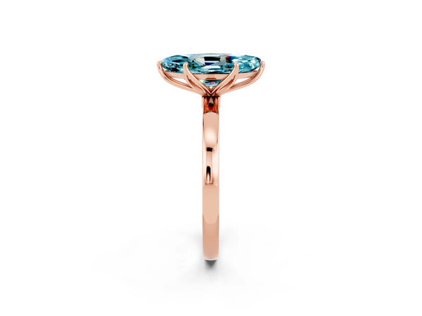 Rose gold Marquise Cut Blue Topaz Solitaire Ring with Thin Band and Prong Setting
