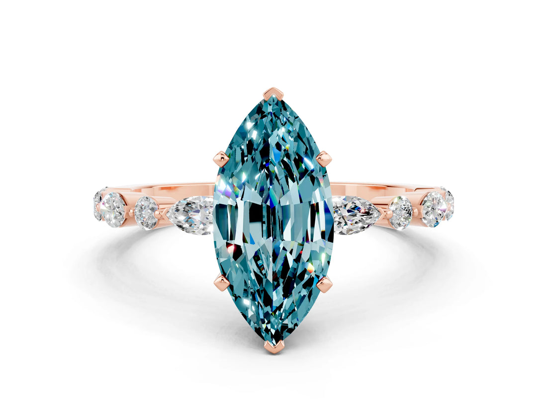 Rose gold Marquise Cut Blue Topaz Solitaire with Side Stones on a Pavé Band and Four-Prong Setting
