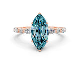 Rose gold Marquise Cut Blue Topaz Solitaire with Side Stones on a Pavé Band and Four-Prong Setting