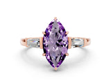 Rose gold Marquise Cut Cut Diamond Ring with Tapered Baguette Side Stones in Four-Prong Setting