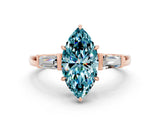 Rose gold Marquise Cut Cut Diamond Ring with Tapered Baguette Side Stones in Four-Prong Setting