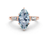 Rose gold Marquise Cut Cut Diamond Ring with Tapered Baguette Side Stones in Four-Prong Setting