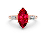 Rose gold Marquise Cut Cut Diamond Ring with Tapered Baguette Side Stones in Four-Prong Setting