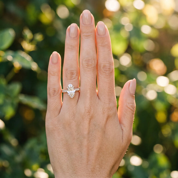 Rose gold Marquise Cut Diamond Solitaire Ring with Milgrain Pave Band and Four Prong Setting