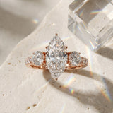 Rose gold Marquise Cut Diamond Three-Stone Ring with Round Side Stones and Pavé Band_15
