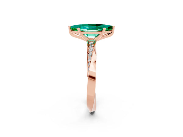 Rose gold Marquise Cut Emerald Engagement Ring with Side Stone Accents and Four-Prong Setting