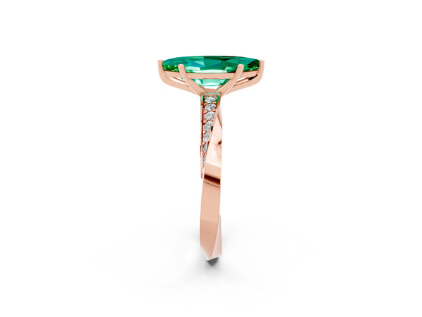 Rose gold Marquise Cut Emerald Engagement Ring with Side Stone Accents and Four-Prong Setting