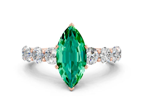 Rose gold Marquise Cut Emerald Prong Setting with Side Stones on a Pave Band