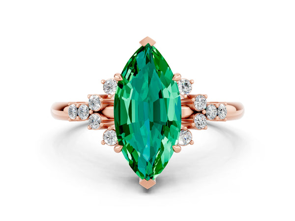 Rose gold Marquise Cut Emerald Ring with Side Stones and Four-Prong Setting