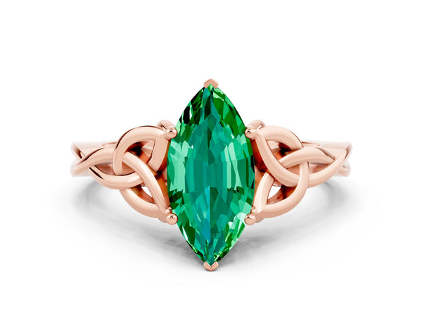 Rose gold Marquise Cut Emerald Solitaire Engagement Ring with Celtic Knot Band and Four-Prong Setting