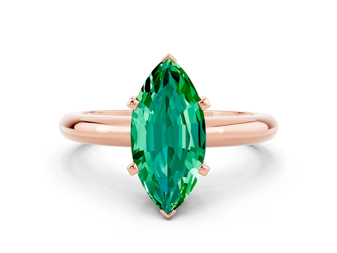 Rose gold Marquise Cut Emerald Solitaire Engagement Ring with Round Band and Four-Prong Setting
