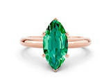 Rose gold Marquise Cut Emerald Solitaire Engagement Ring with Round Band and Four-Prong Setting
