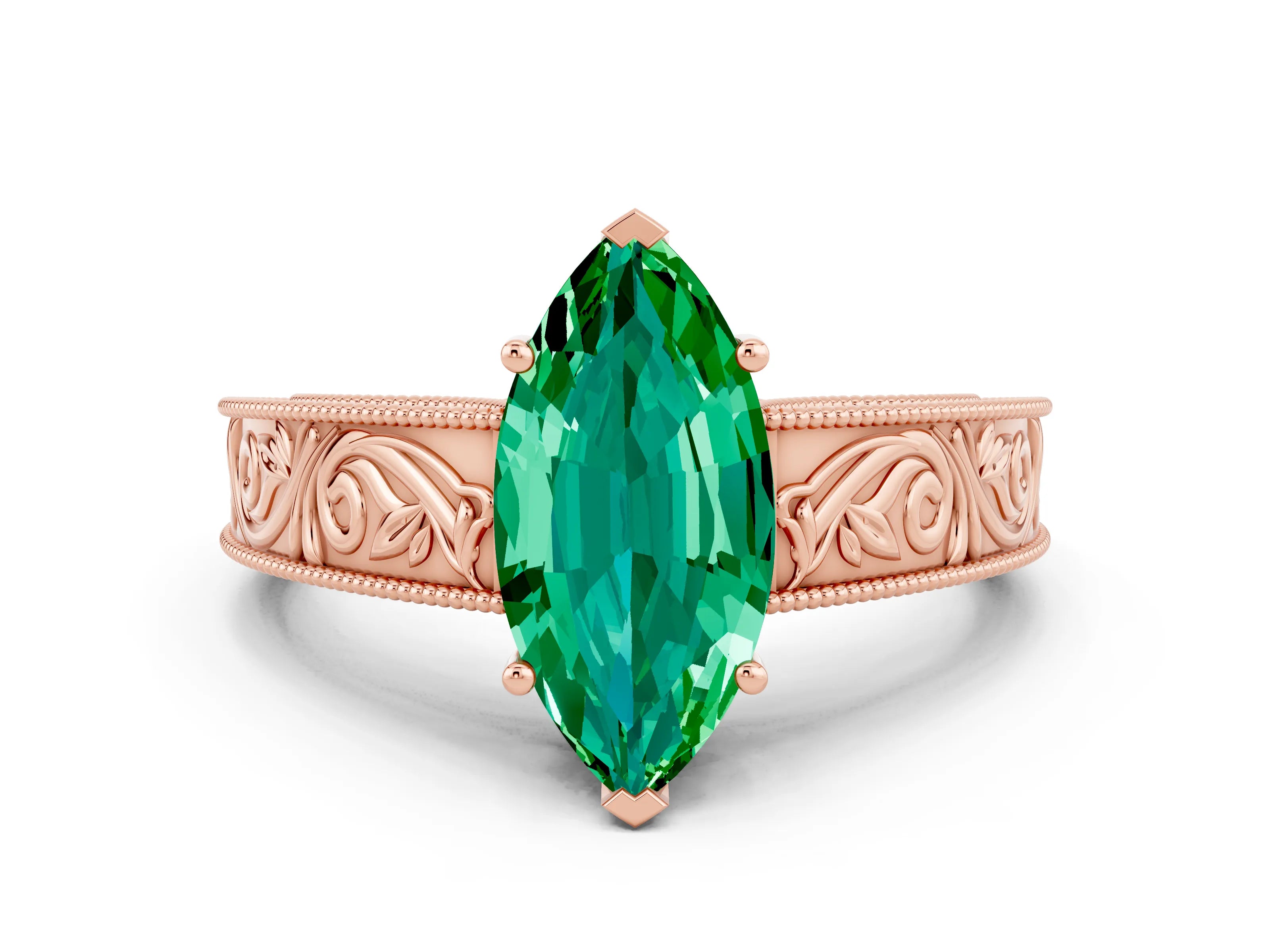 Rose gold Marquise Cut Emerald Solitaire Ring with Engraved Band and Four-Prong Setting