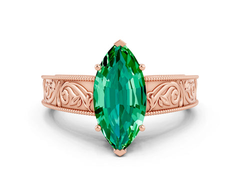 Rose gold Marquise Cut Emerald Solitaire Ring with Engraved Band and Four-Prong Setting