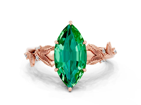 Rose gold Marquise Cut Emerald Solitaire Ring with Leaf Motif Band and Four-Prong Setting
