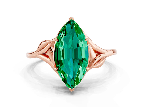 Rose gold Marquise Cut Emerald Solitaire Ring with Twist Band and Four-Prong Setting