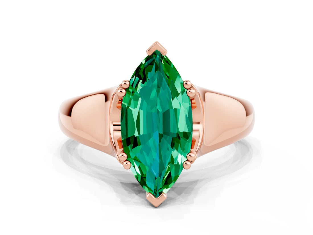 Rose gold Marquise Cut Emerald Solitaire Ring with Wide Band and Prong Setting