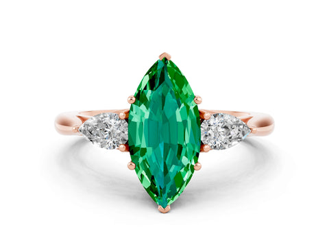 Rose gold Marquise Cut Emerald Three-Stone Ring with Pear Side Stones and Four-Prong Setting_12