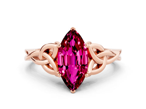 Rose gold Marquise Cut Garnet Solitaire Engagement Ring with Celtic Knot Band and Four-Prong Setting