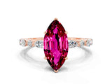 Rose gold Marquise Cut Garnet Solitaire with Side Stones on a Pavé Band and Four-Prong Setting