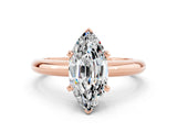 Rose gold Marquise Cut Moissanite Solitaire Engagement Ring with Round Band and Four-Prong Setting