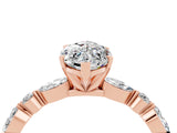 Rose gold Marquise Cut Moissanite Solitaire with Side Stones on a Pavé Band and Four-Prong Setting_4